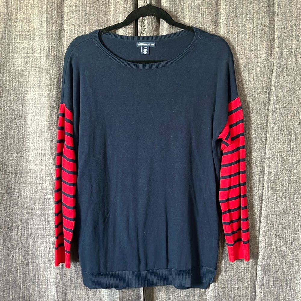 American living blue round neck sweater with red and blue striped sleeves large